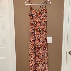 A super cute maxi dress with a fun back and slits!